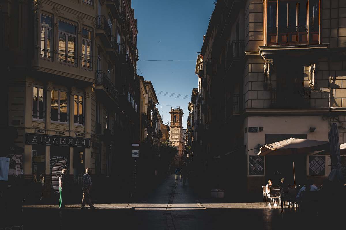 city people beside building road