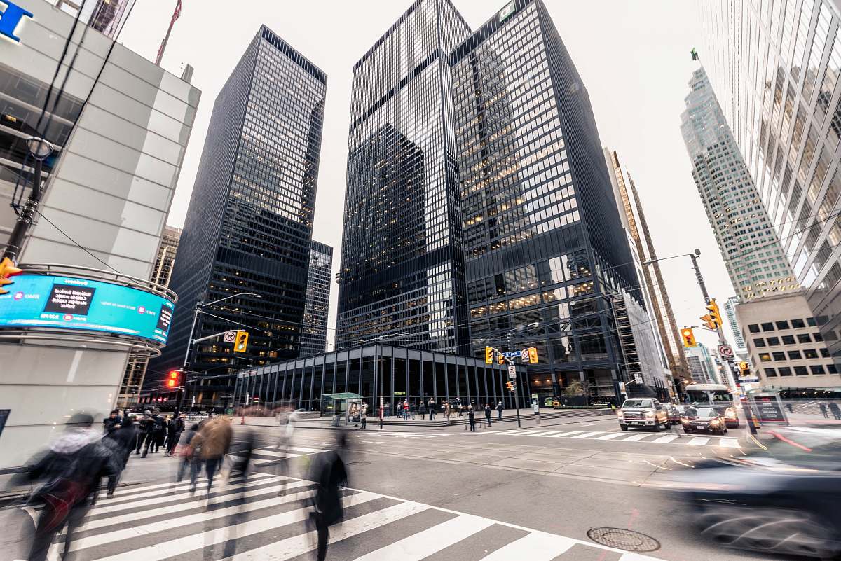 urban people crossing on pedestrian lane in front high-rise buildings skyscraper