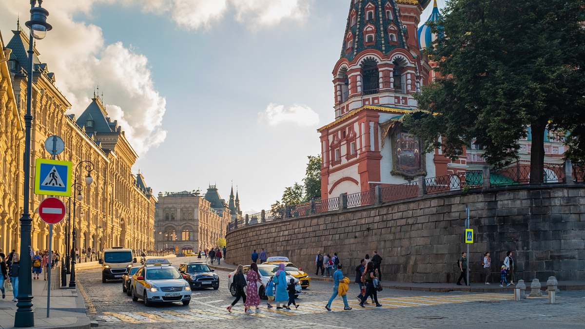 city people crossing street during daytime downtown