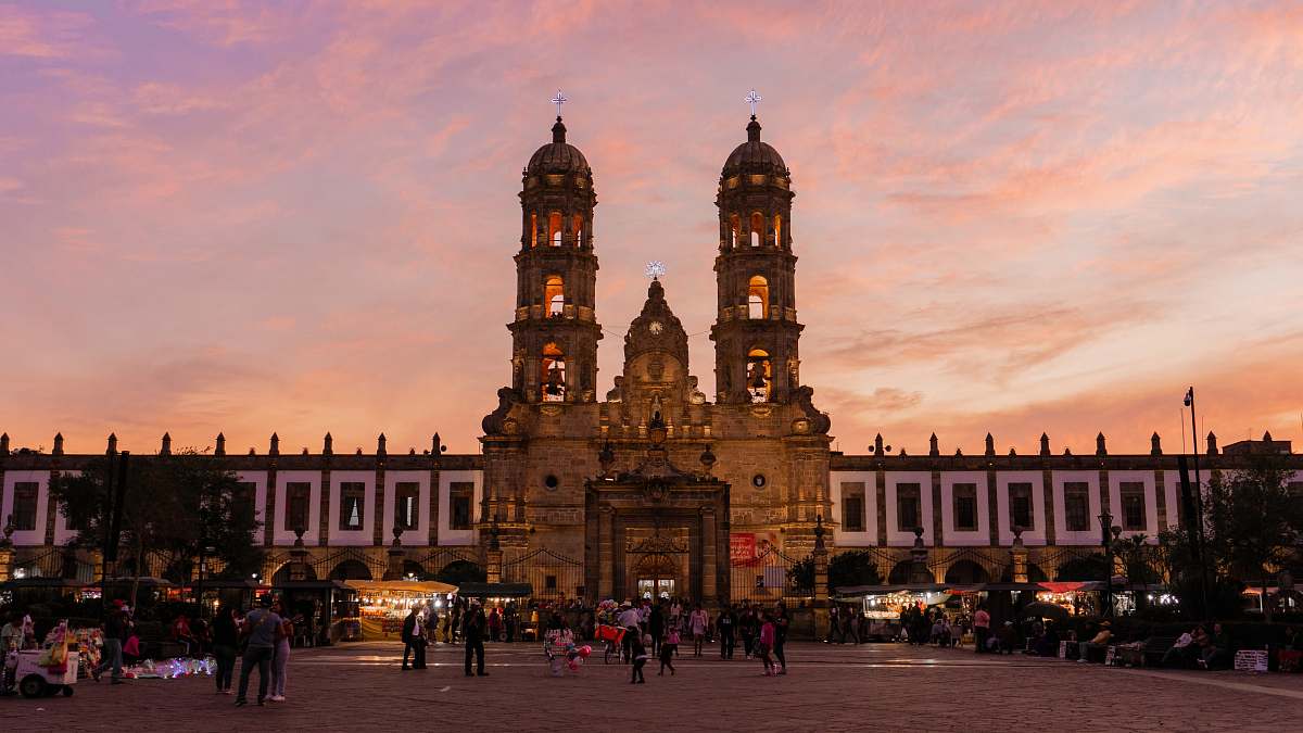 city people in front of cathedral downtown