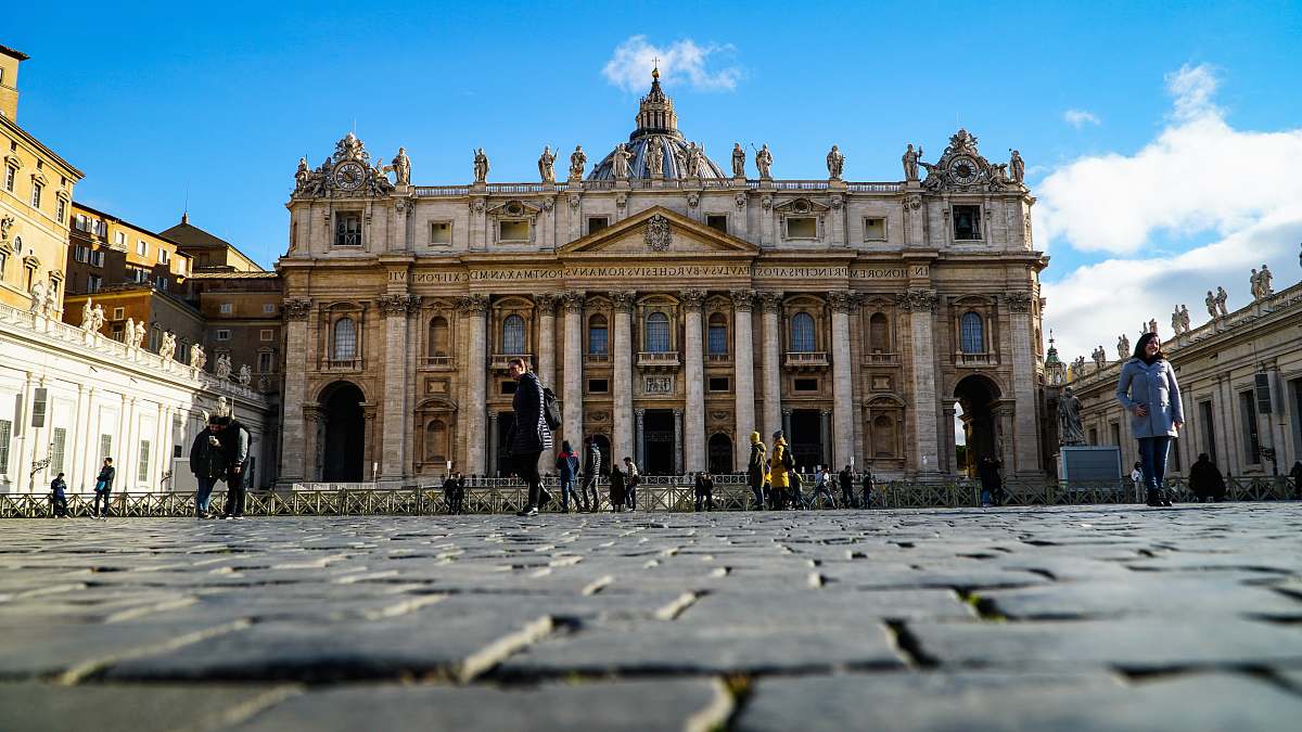 city people in front of cathedral during daytime downtown