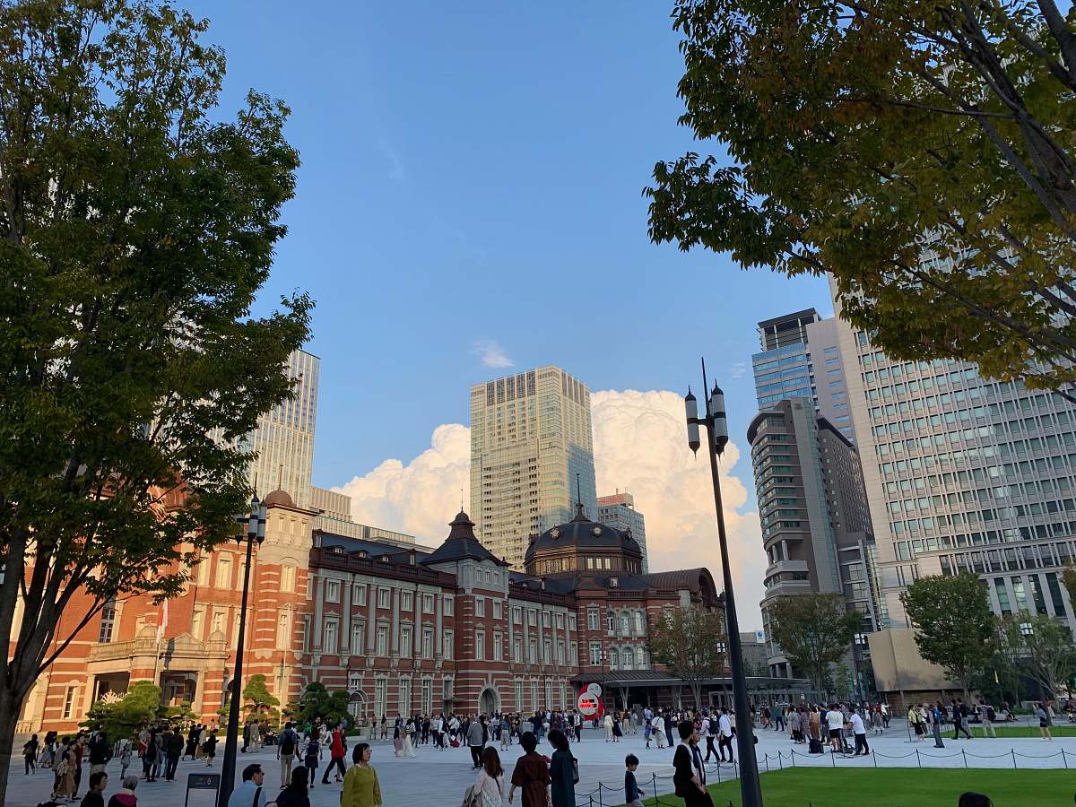 city people near building downtown