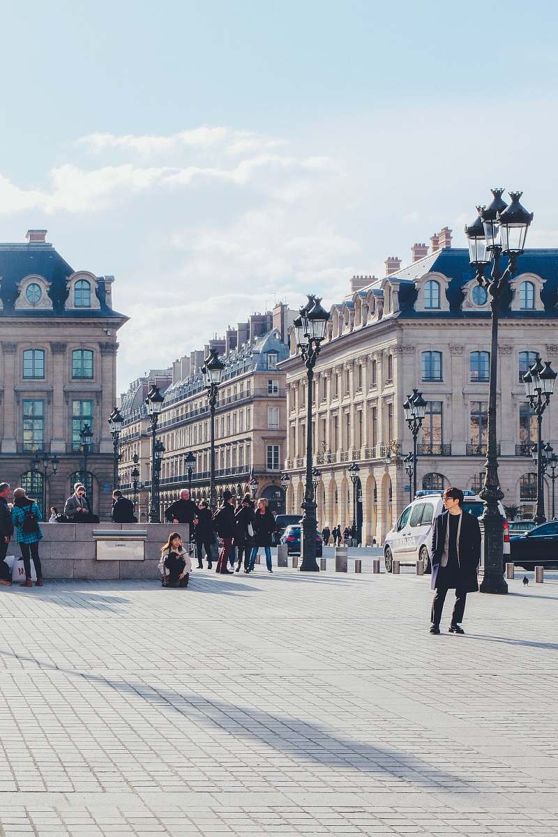 city people near building during daytime downtown