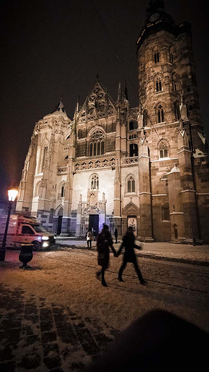 city people near cathedral downtown