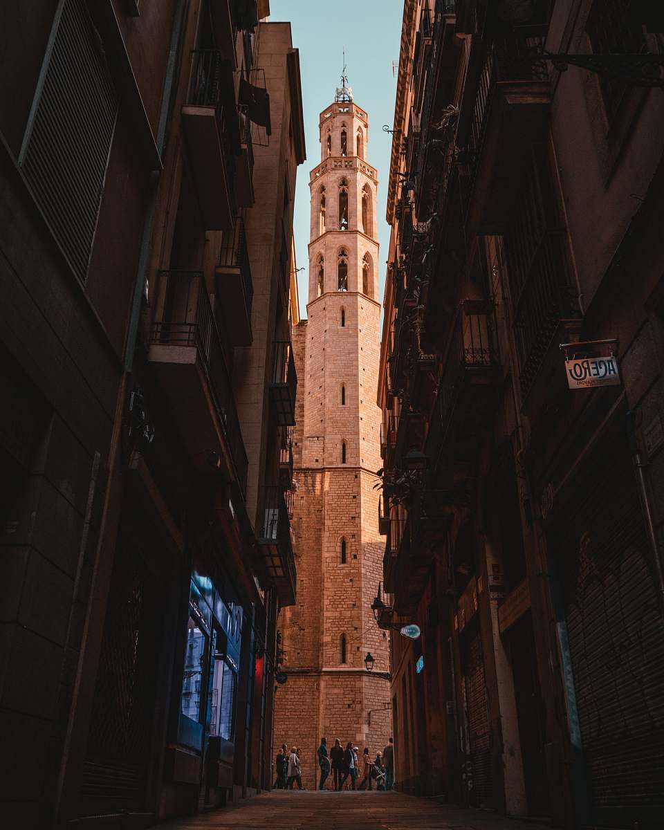 city people standing between building alley