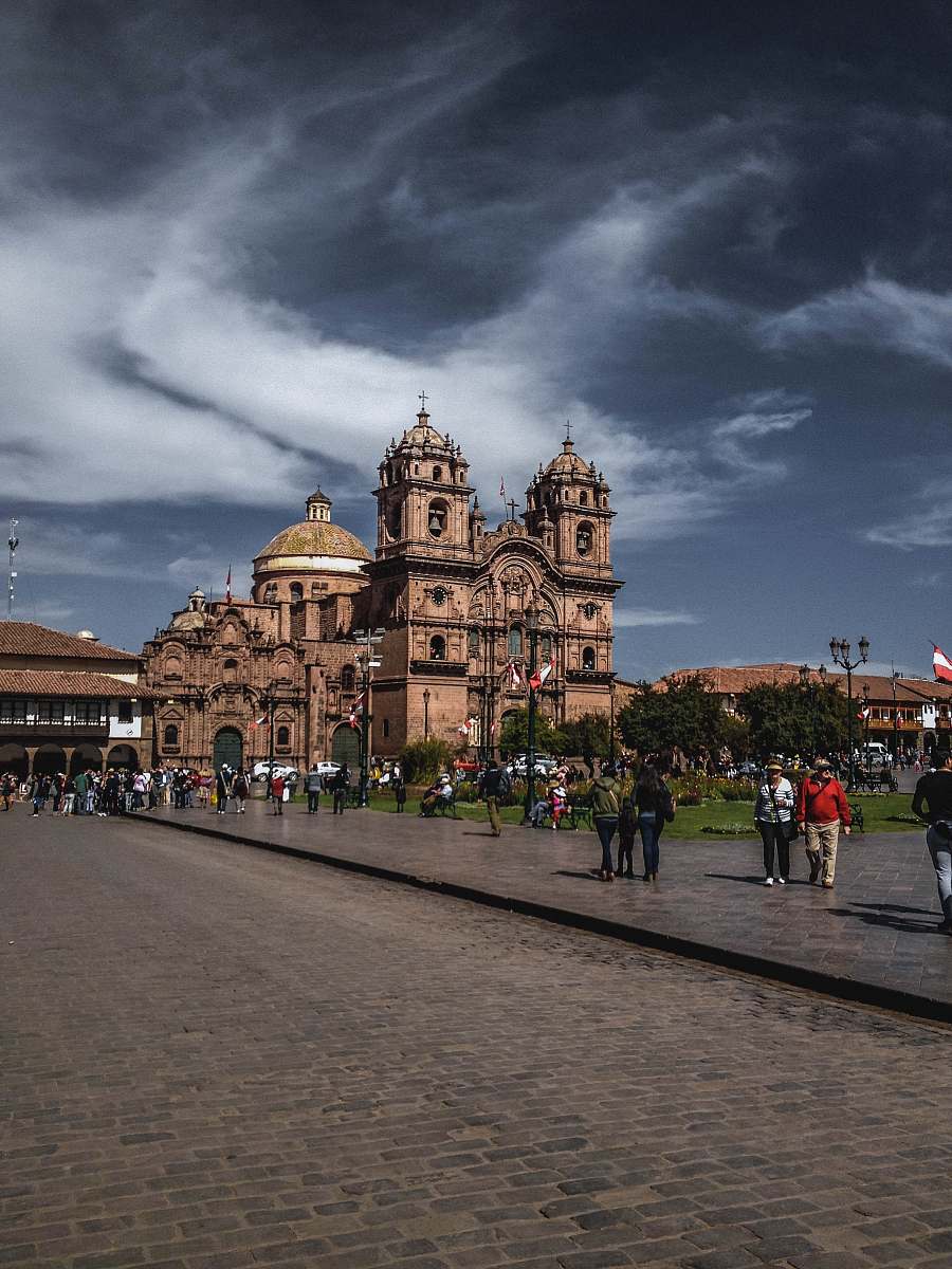 city people walking near cathedral at daytime downtown