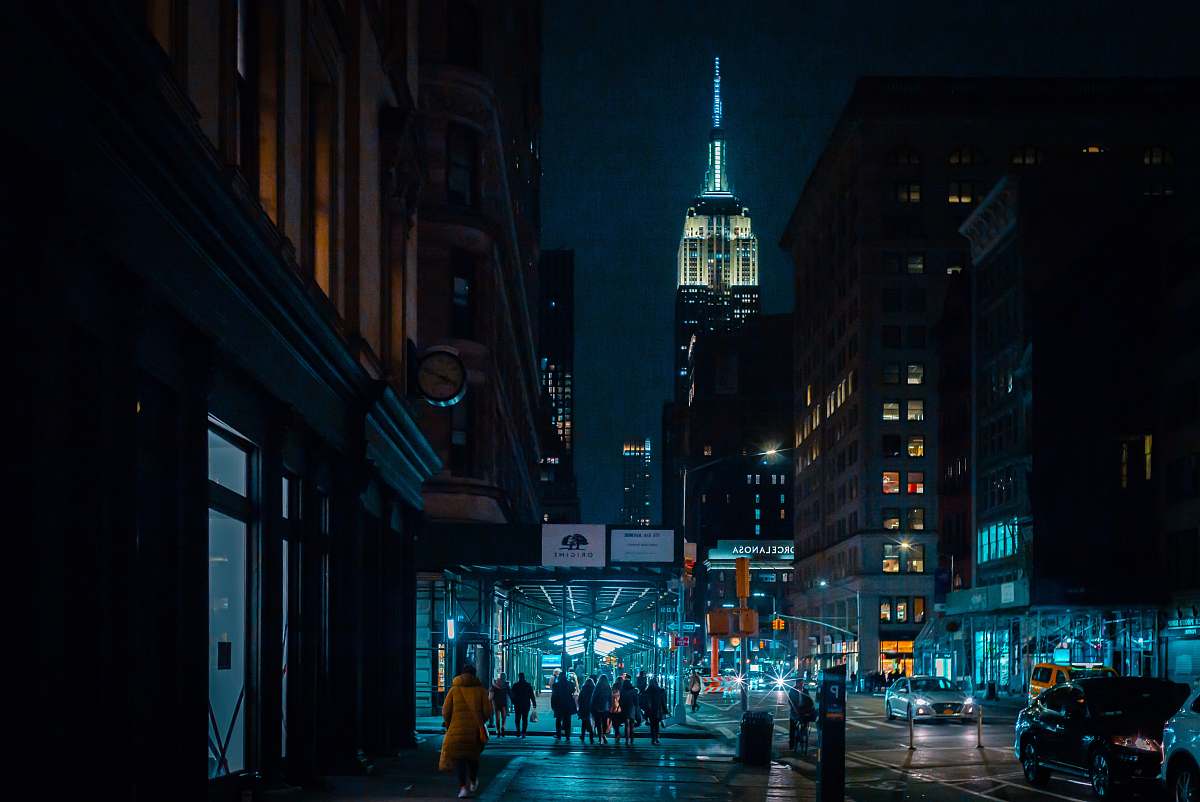 city people walking on street at night downtown