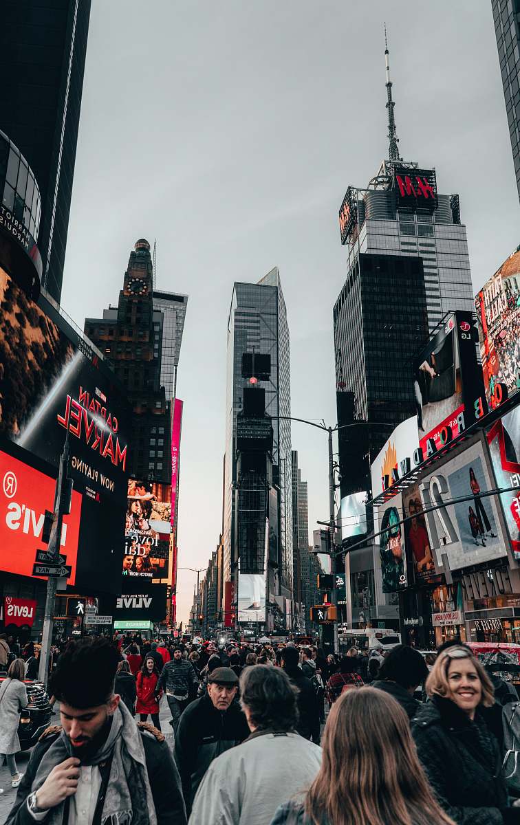 city people walking on street during daytime metropolis