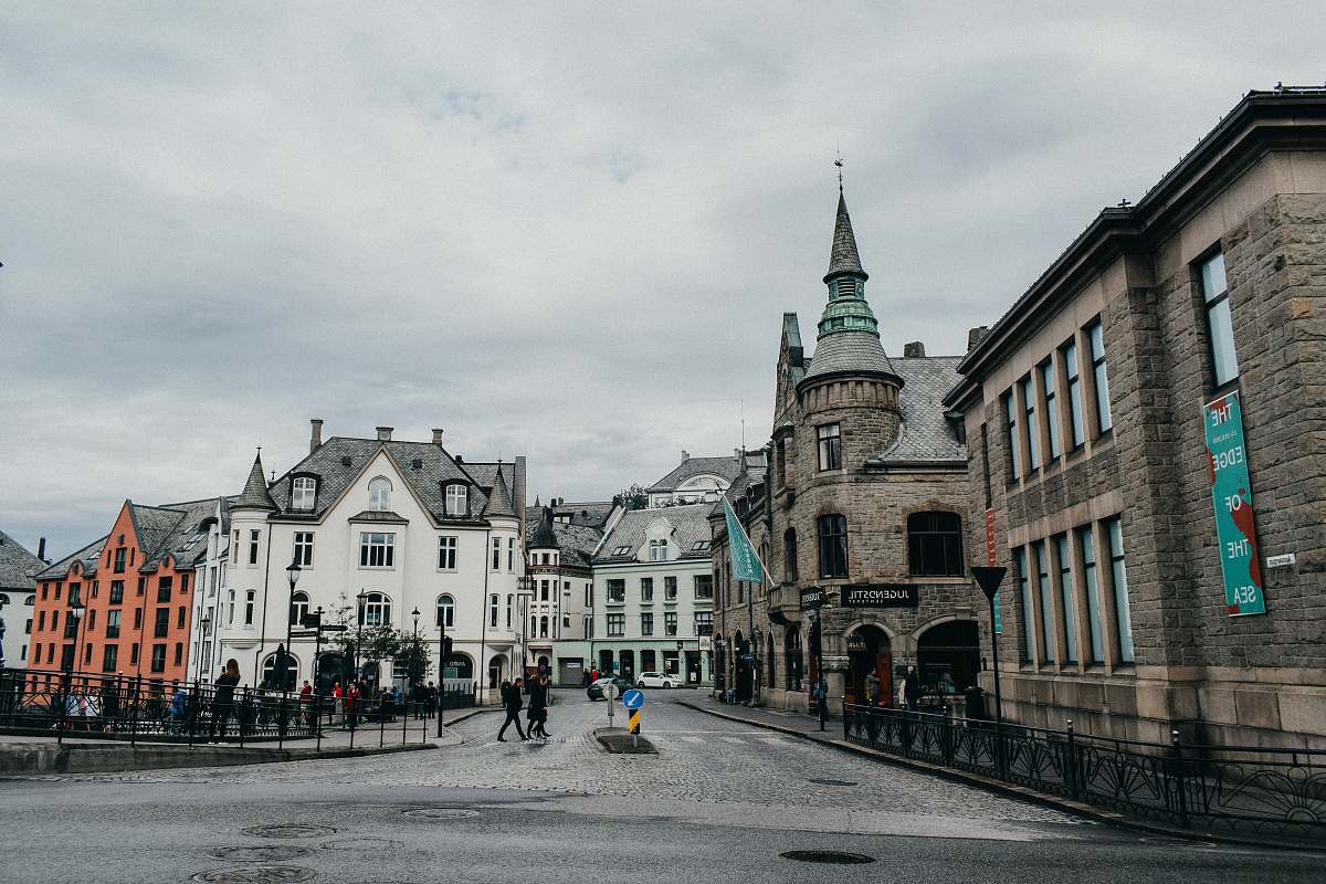 city people walking outside buildings town