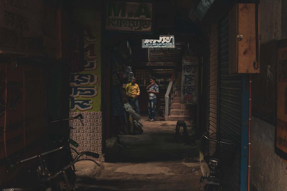 city person standing beside stairs road