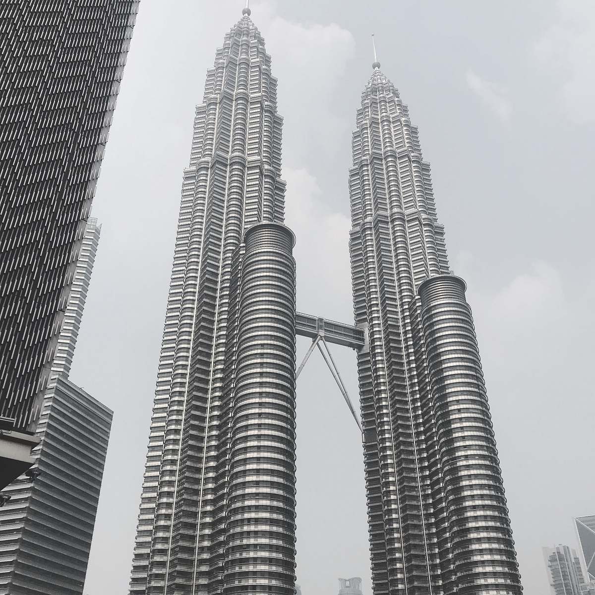 black-and-white Petronas Twin Towers - KLCC, Kuala Lumpur City during day grey