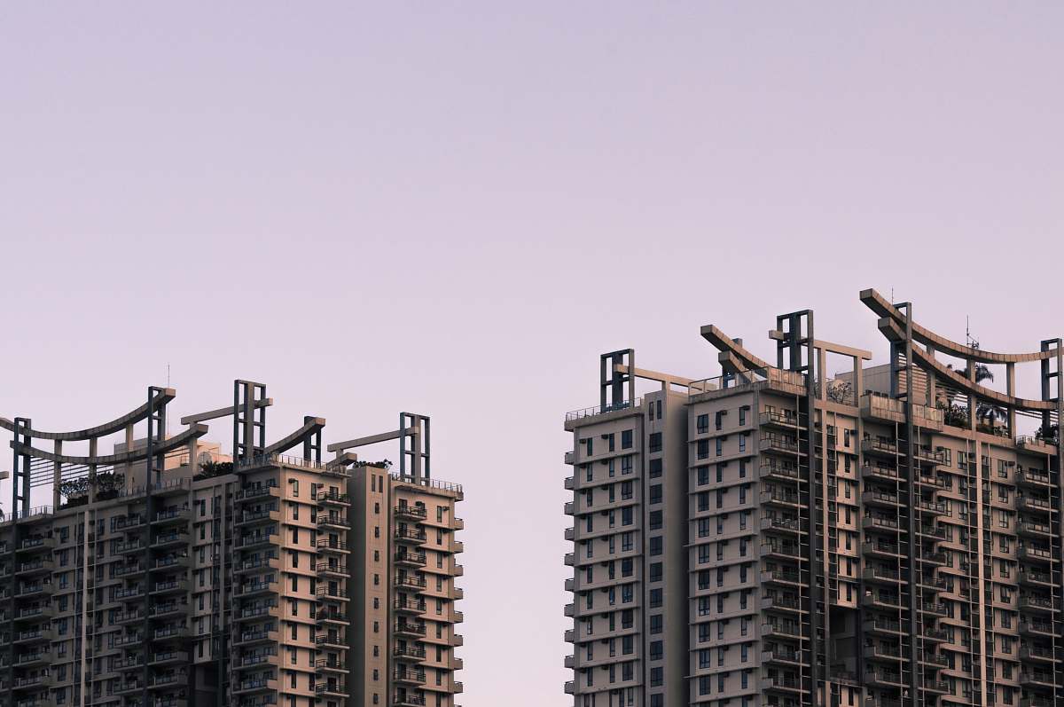 city selective focus photography of two white concrete buildings high rise