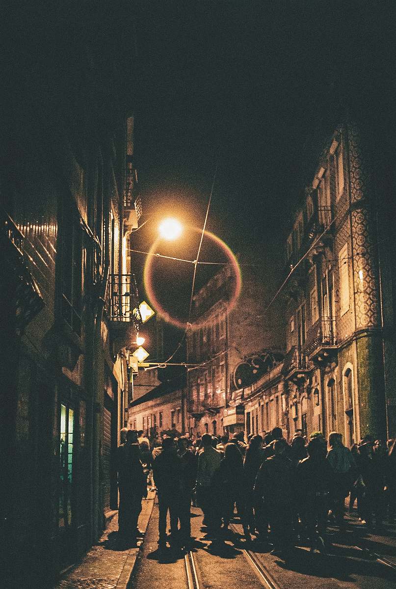 town sepia photography of buildings during nighttime metropolis