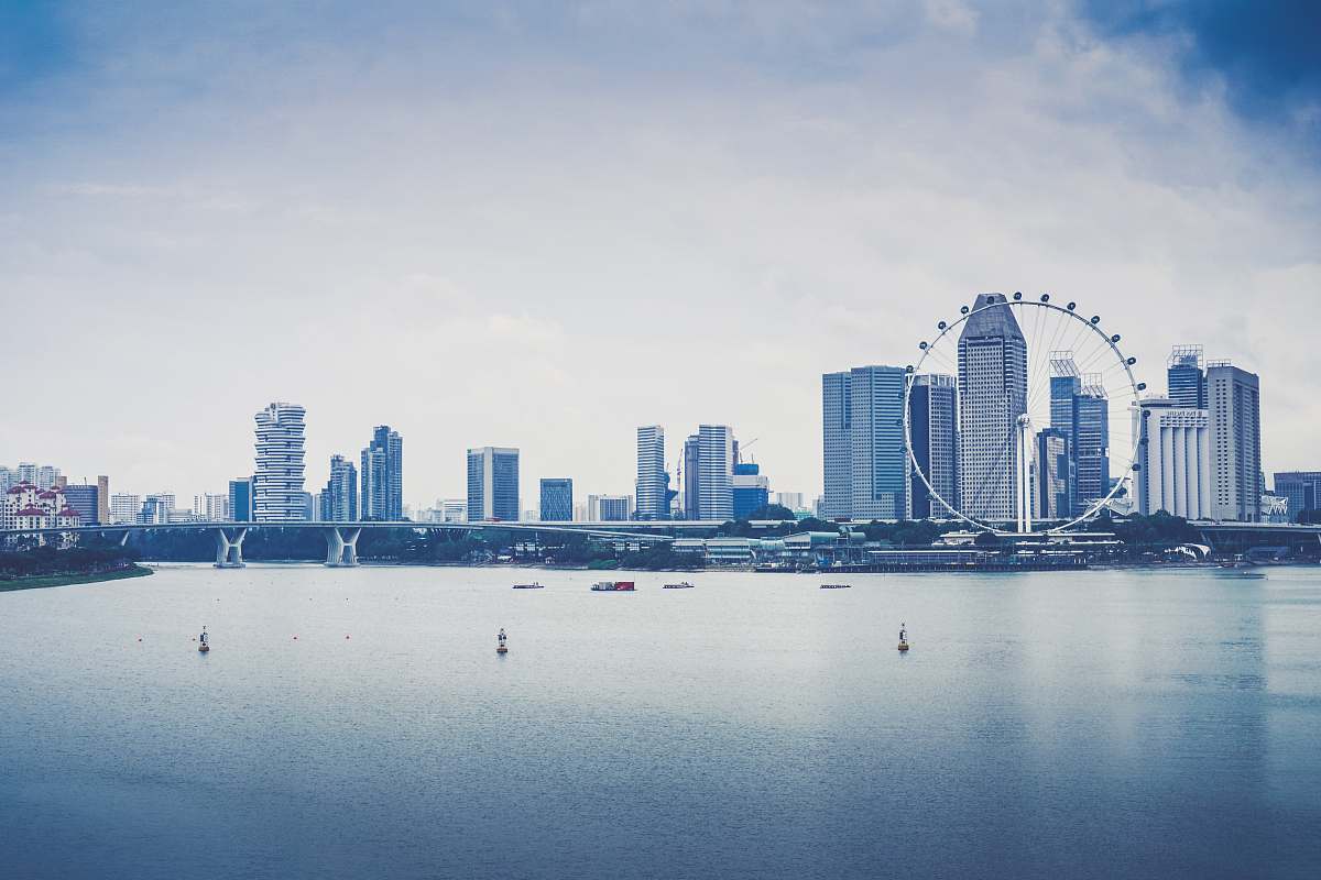 city skyscrapers near body of water singapore