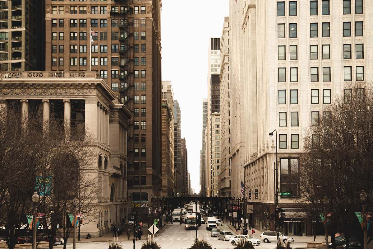 city street between high-rise buildings town