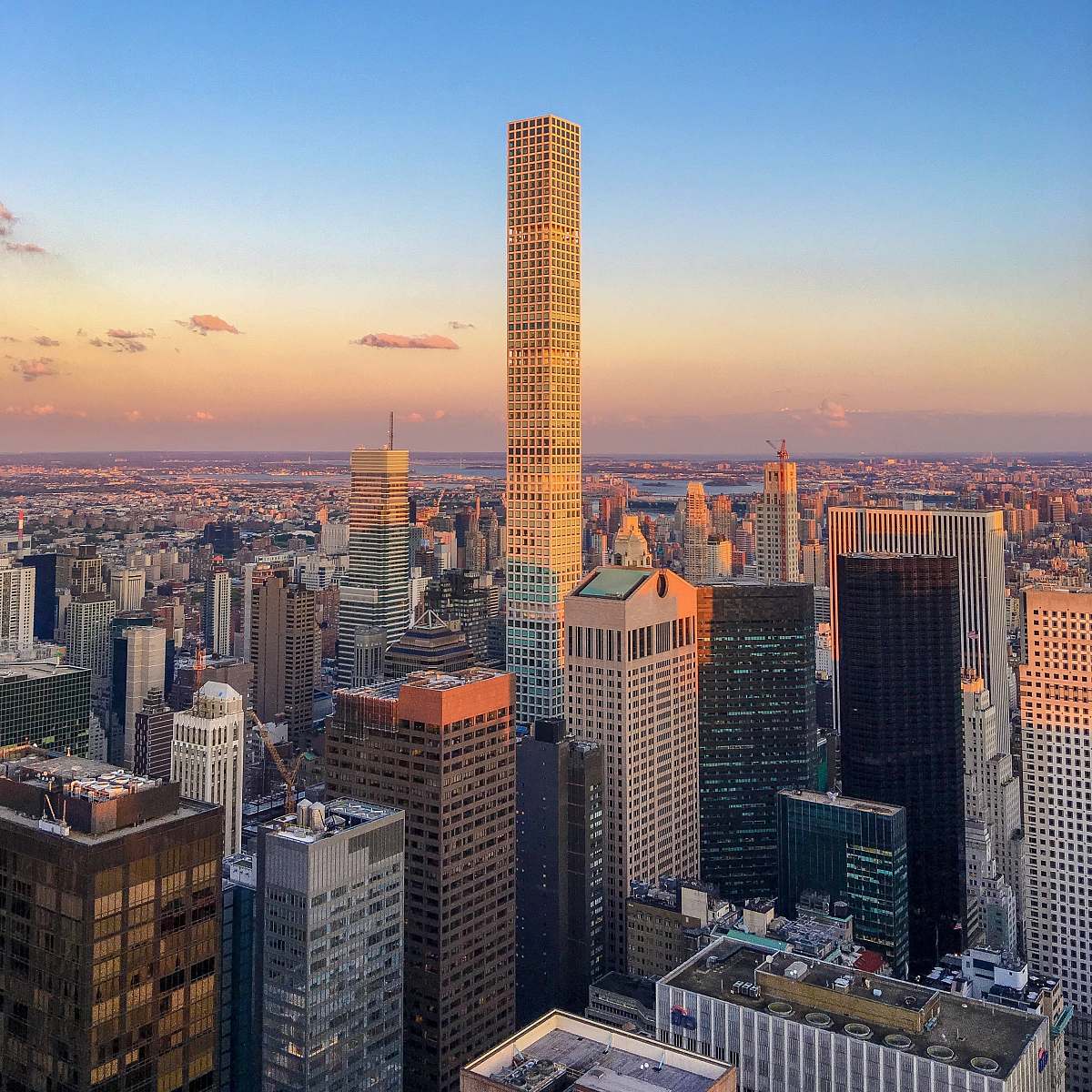 city tallest building in between other high rise building in the city town