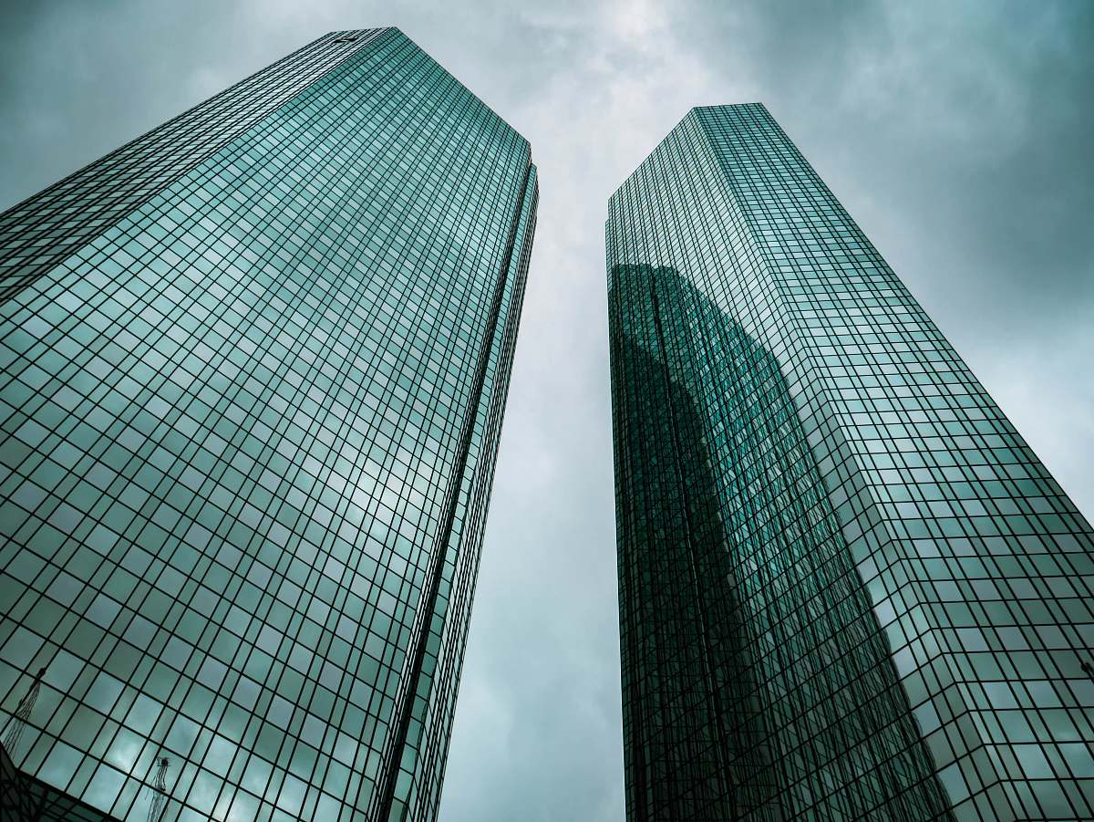 architecture two high-rise buildings under gray clouds during daytime skyscraper