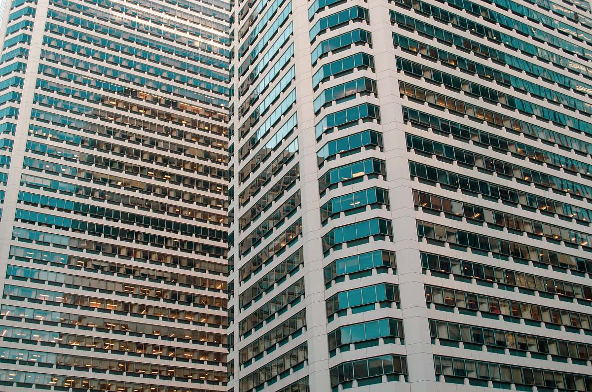 city view of glass high rise buildings high rise