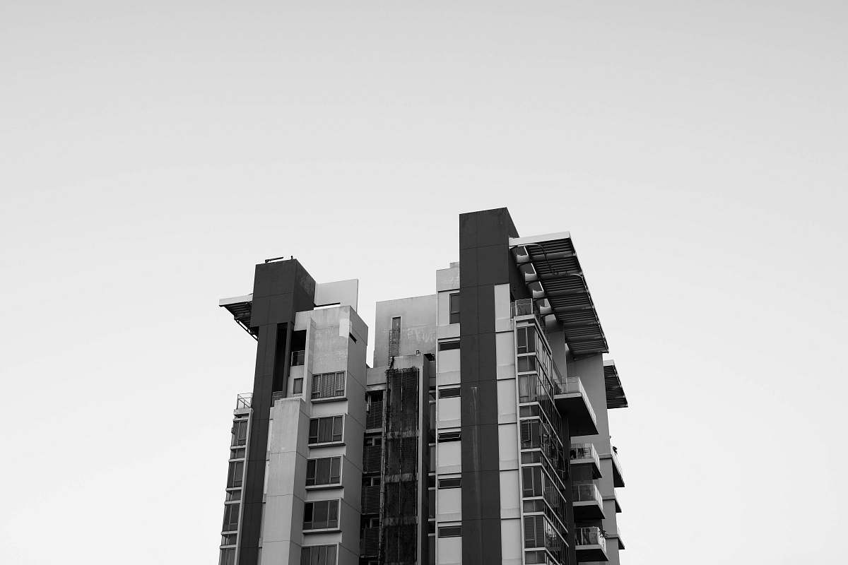 city white and black concrete building at daytime black-and-white