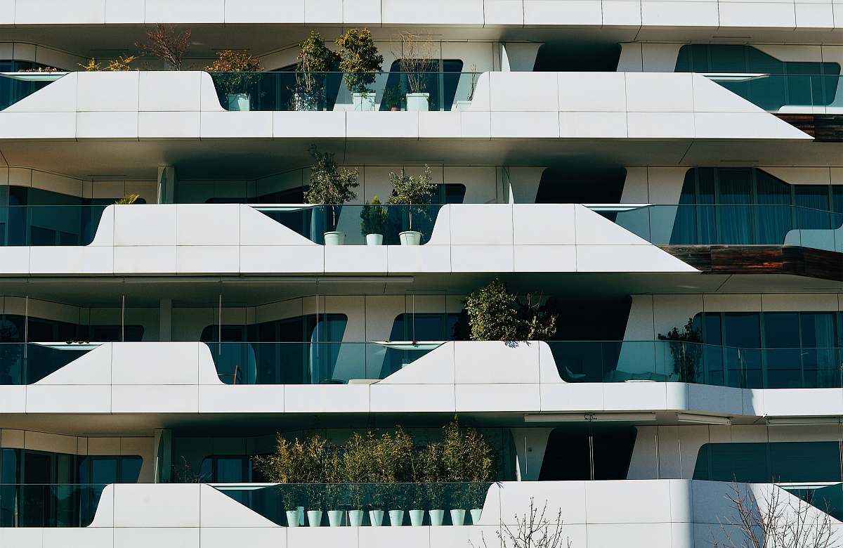 city White and blue-colored four stories building high rise