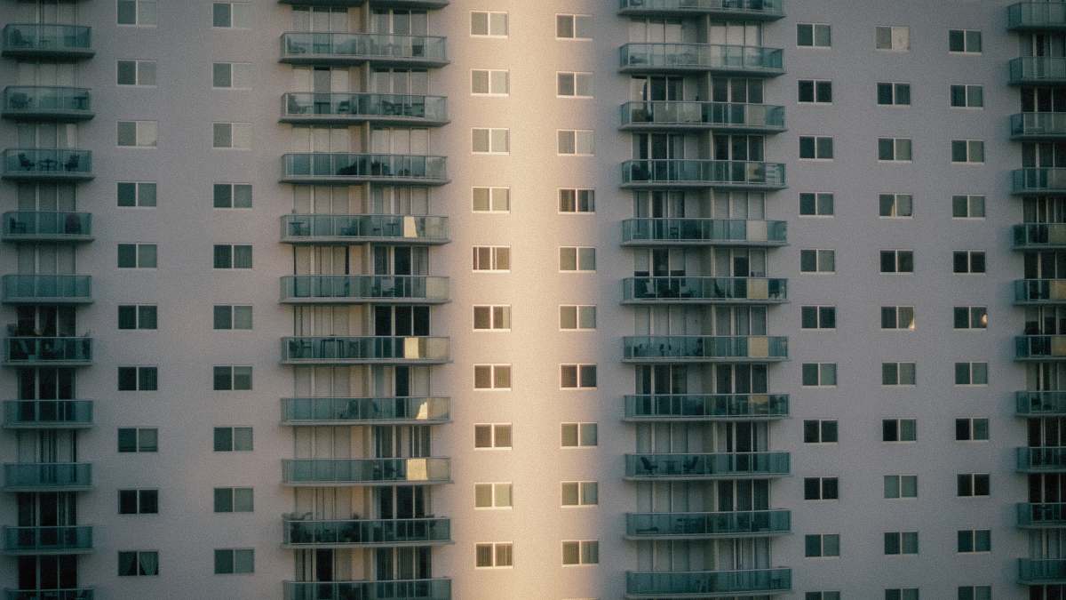 city white and blue concrete building during daytime high rise
