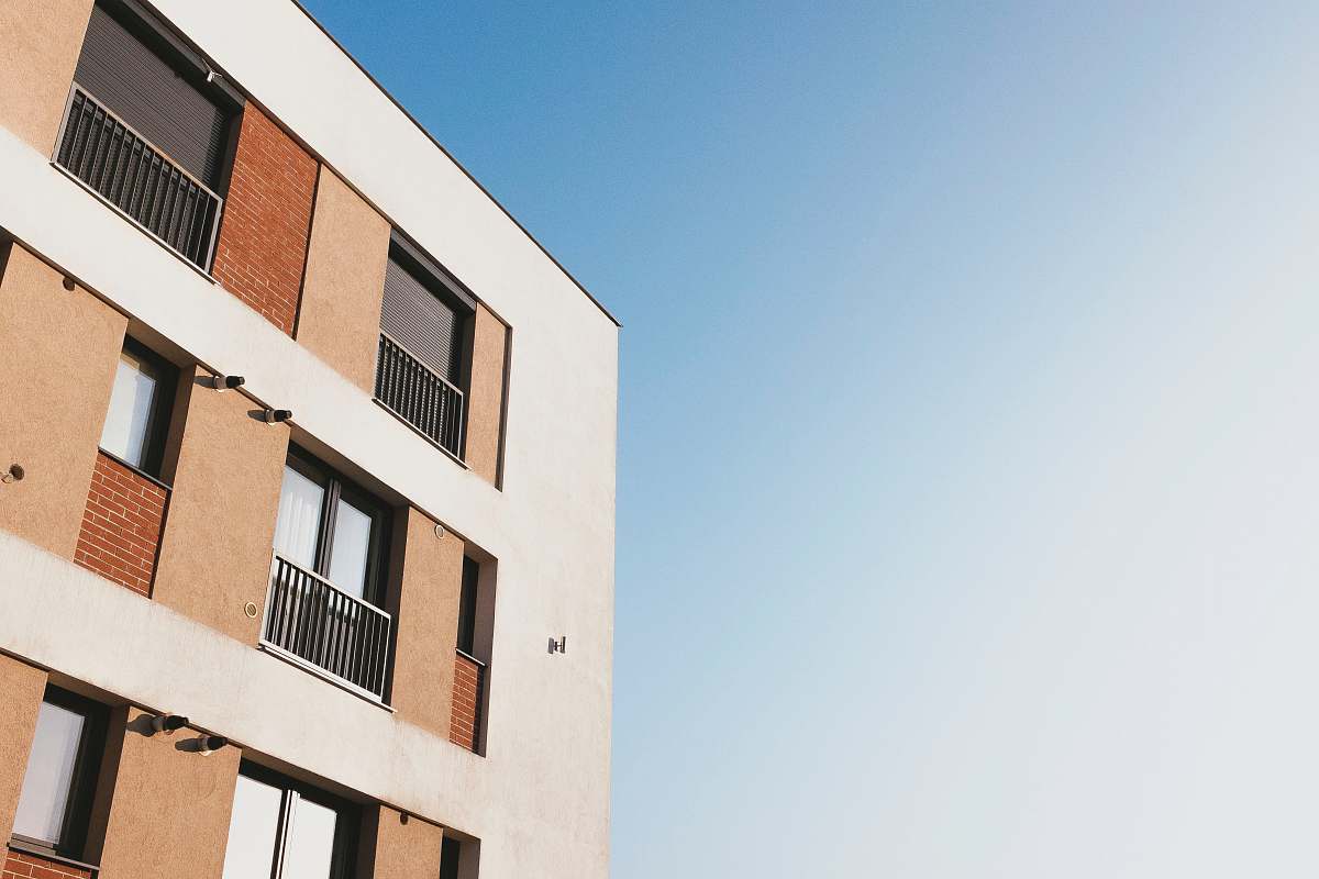 city white and brown concrete building under blue sky during daytime urban