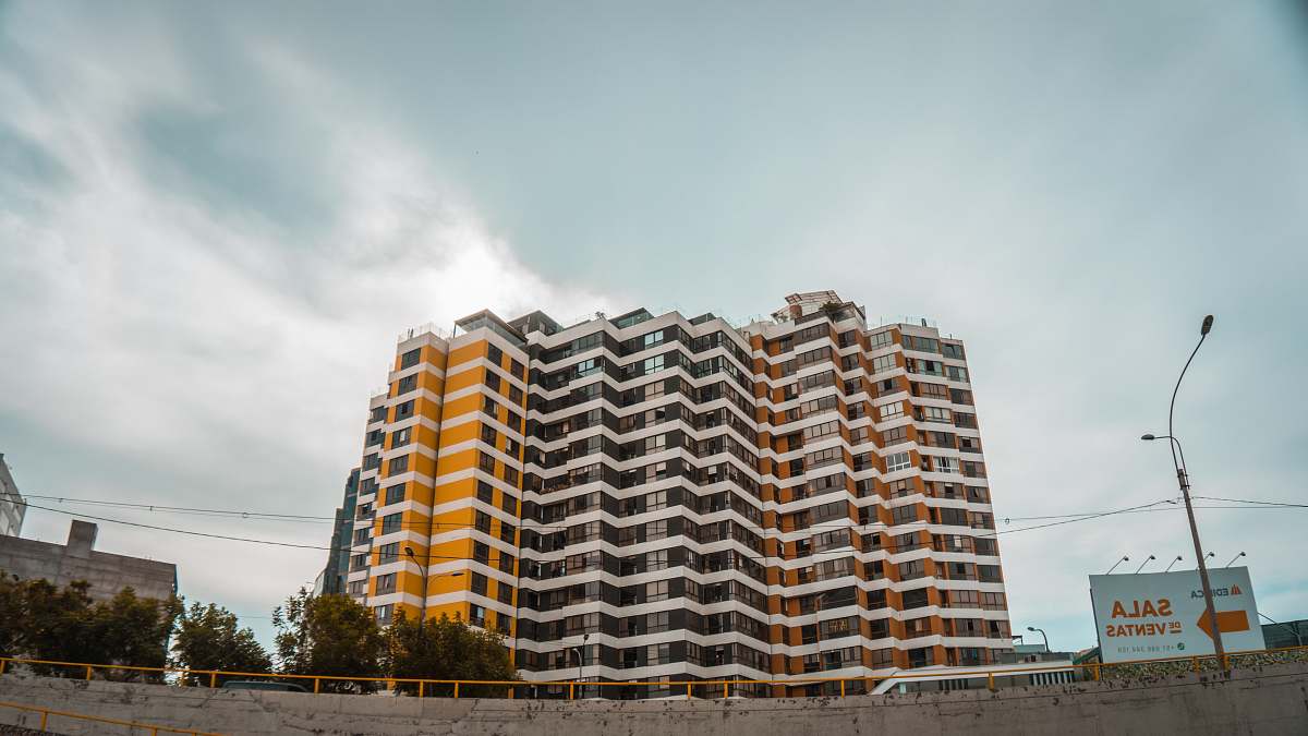condo white and brown high rise building housing