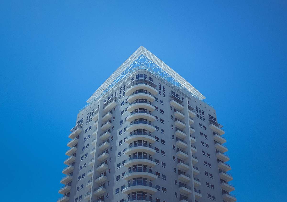 condo white and gray concrete building at daytime housing