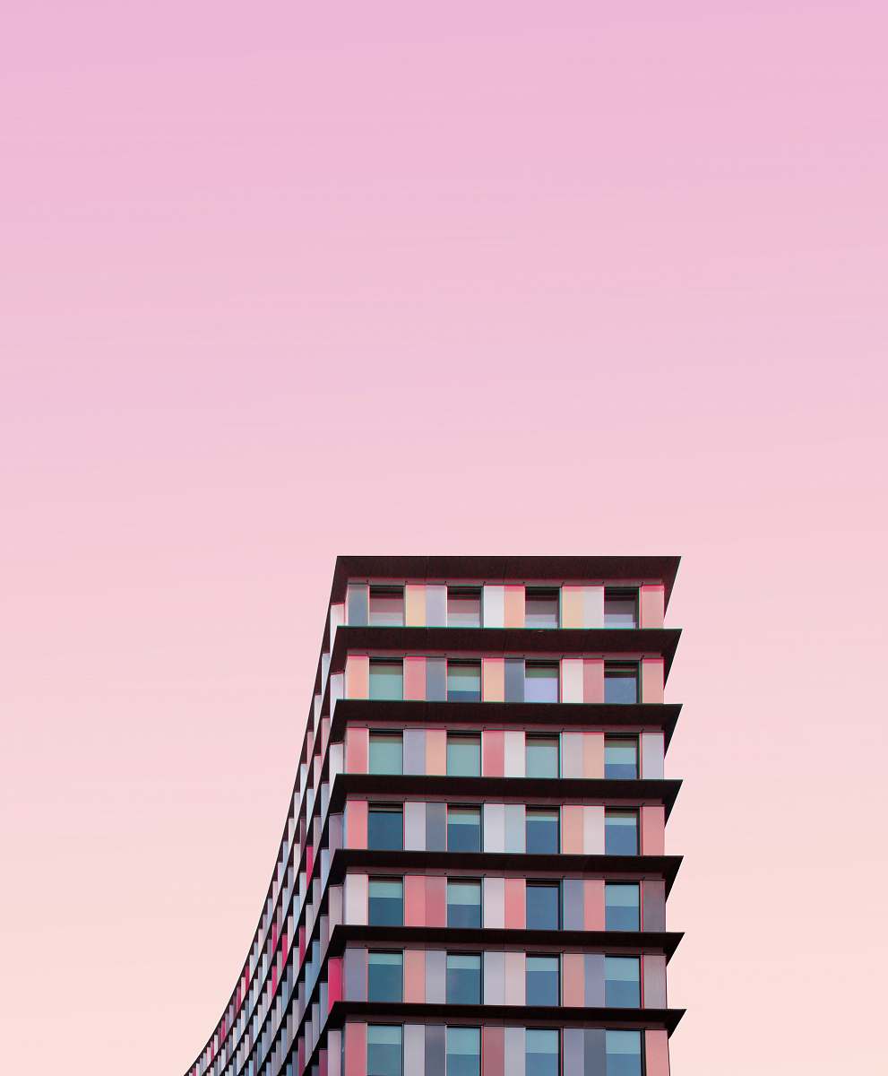 city white and pink concrete building during daytime urban