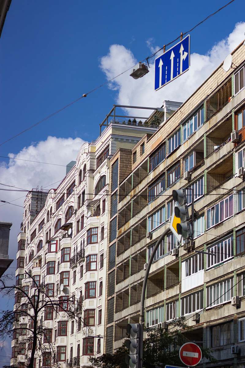 city white building near traffic light during day urban