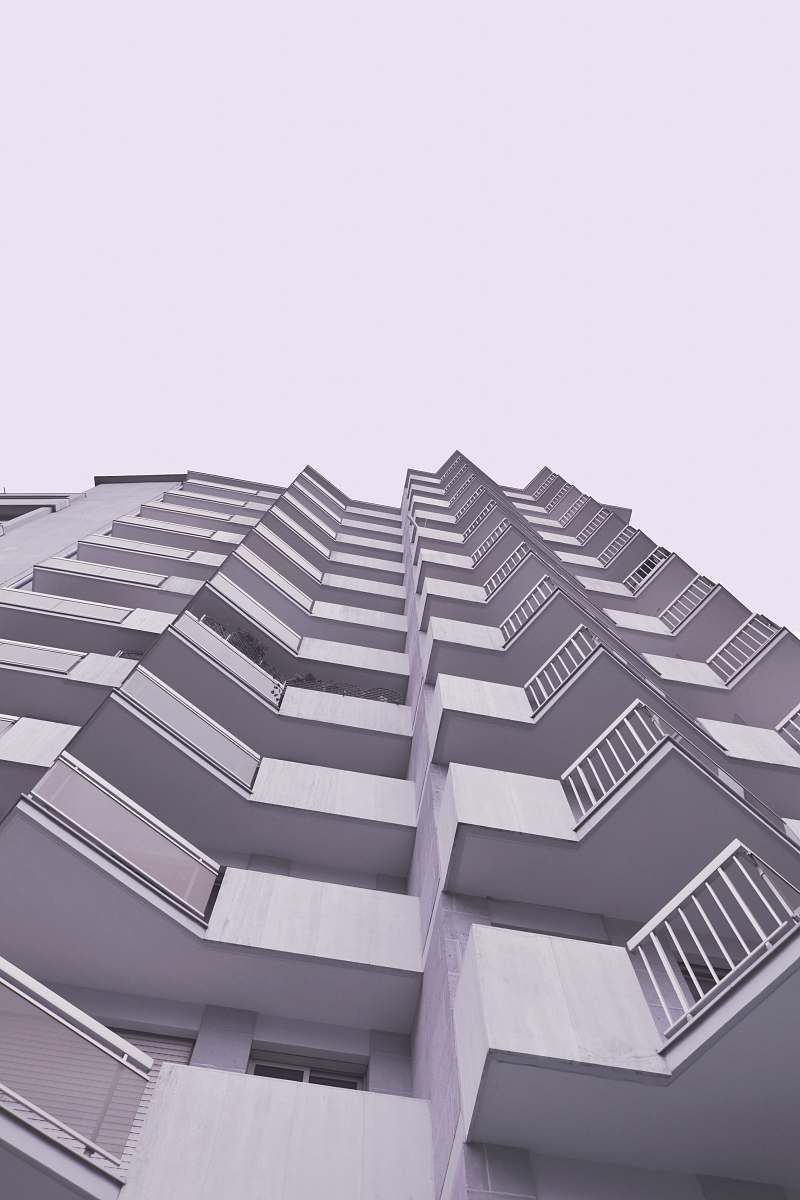 city white concrete building low-angle photography high rise