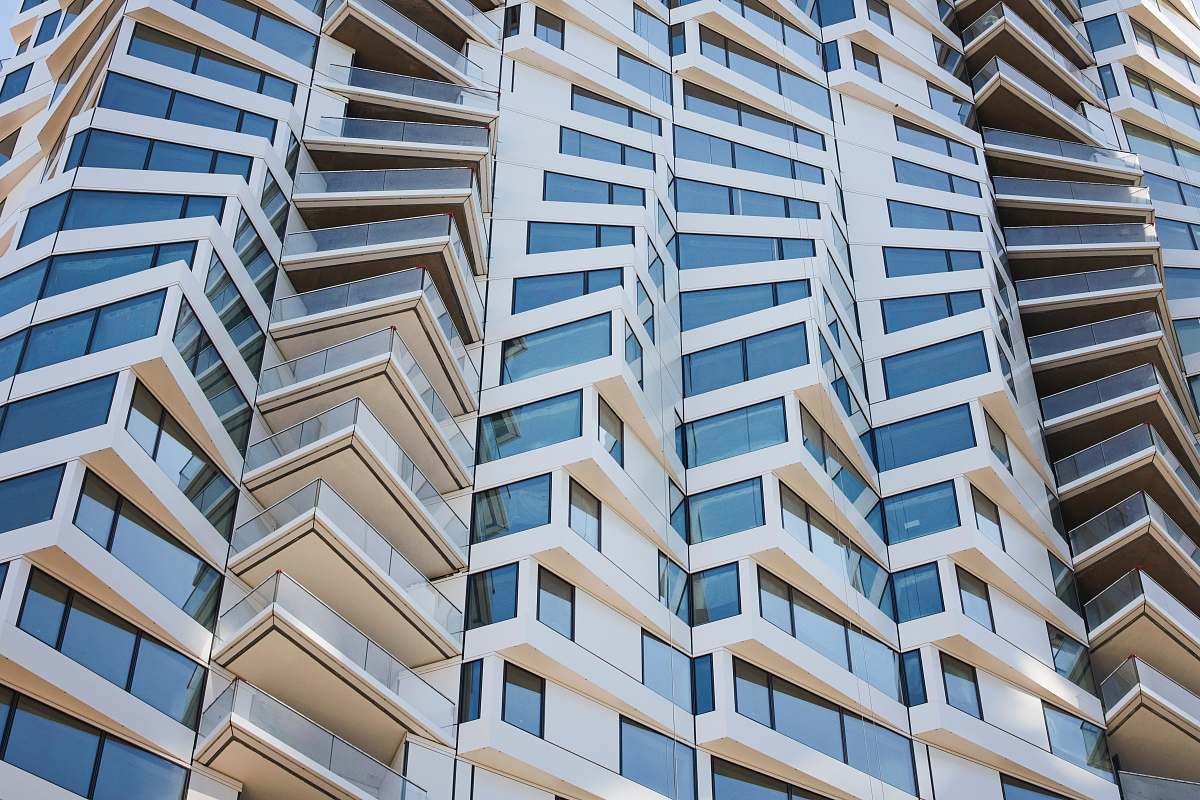 urban white glass building high rise