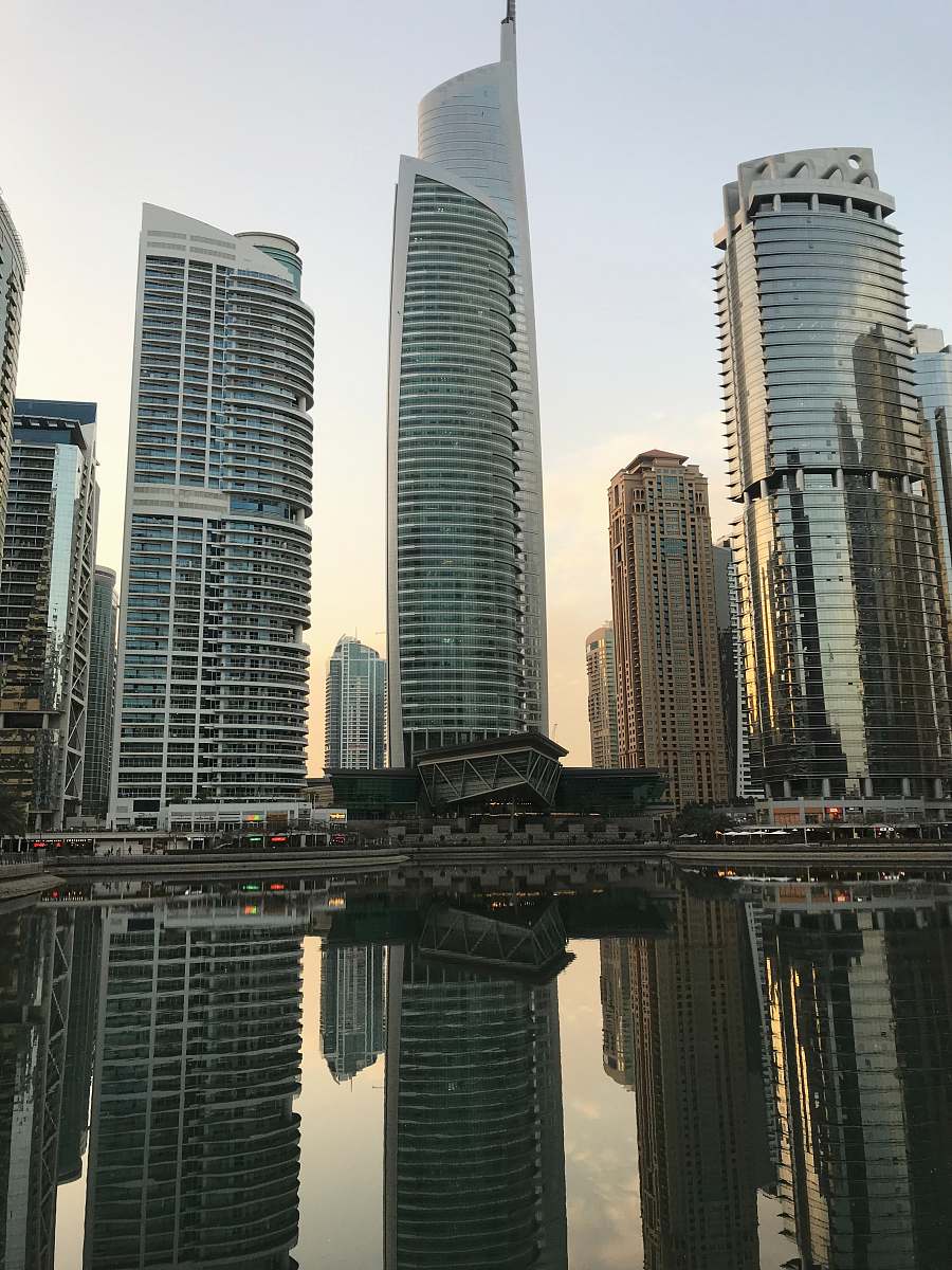 city white high-rise buildings during daytime high rise