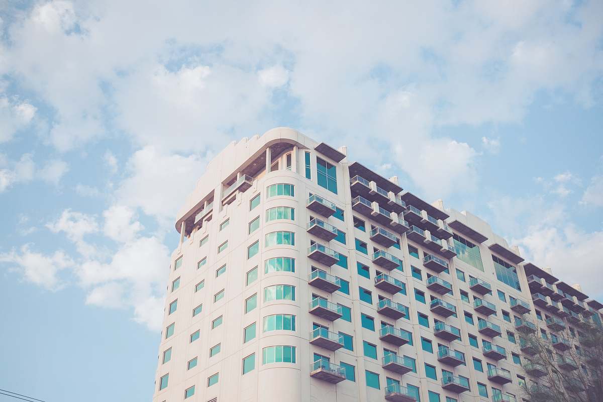 condo white high-rise concrete building housing