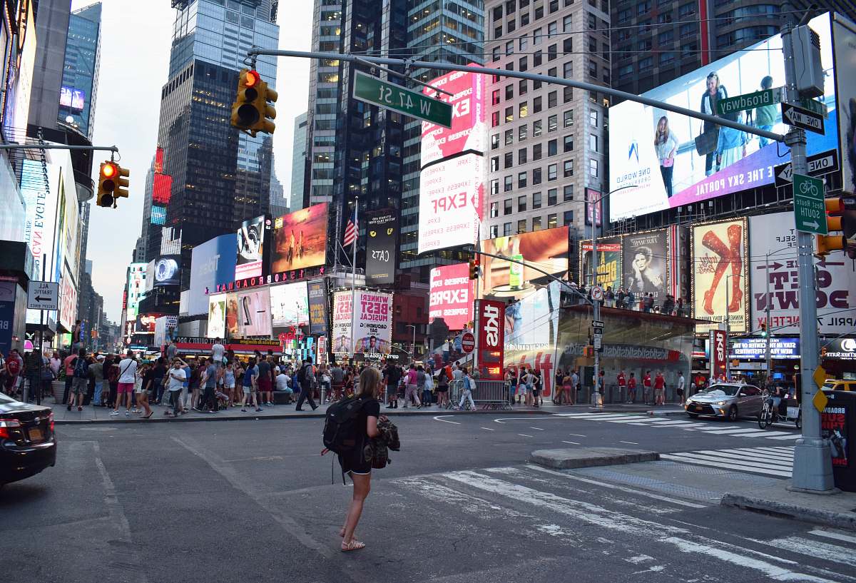 city woman crossing on road urban