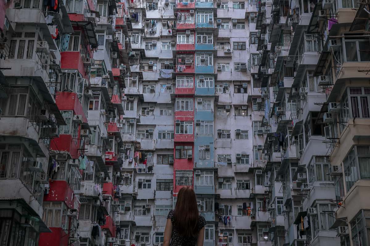 city woman in front of high rise building high rise