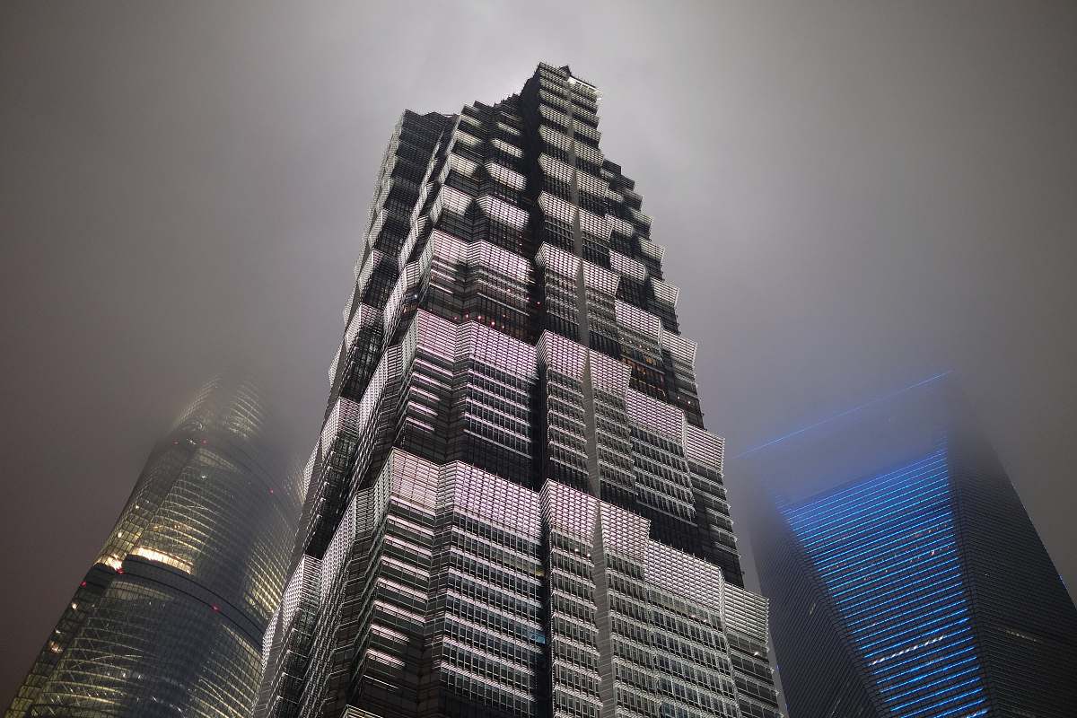 city worm view photo of black building high rise