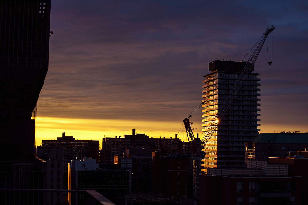 city yellow sunset above high-rise buildings urban