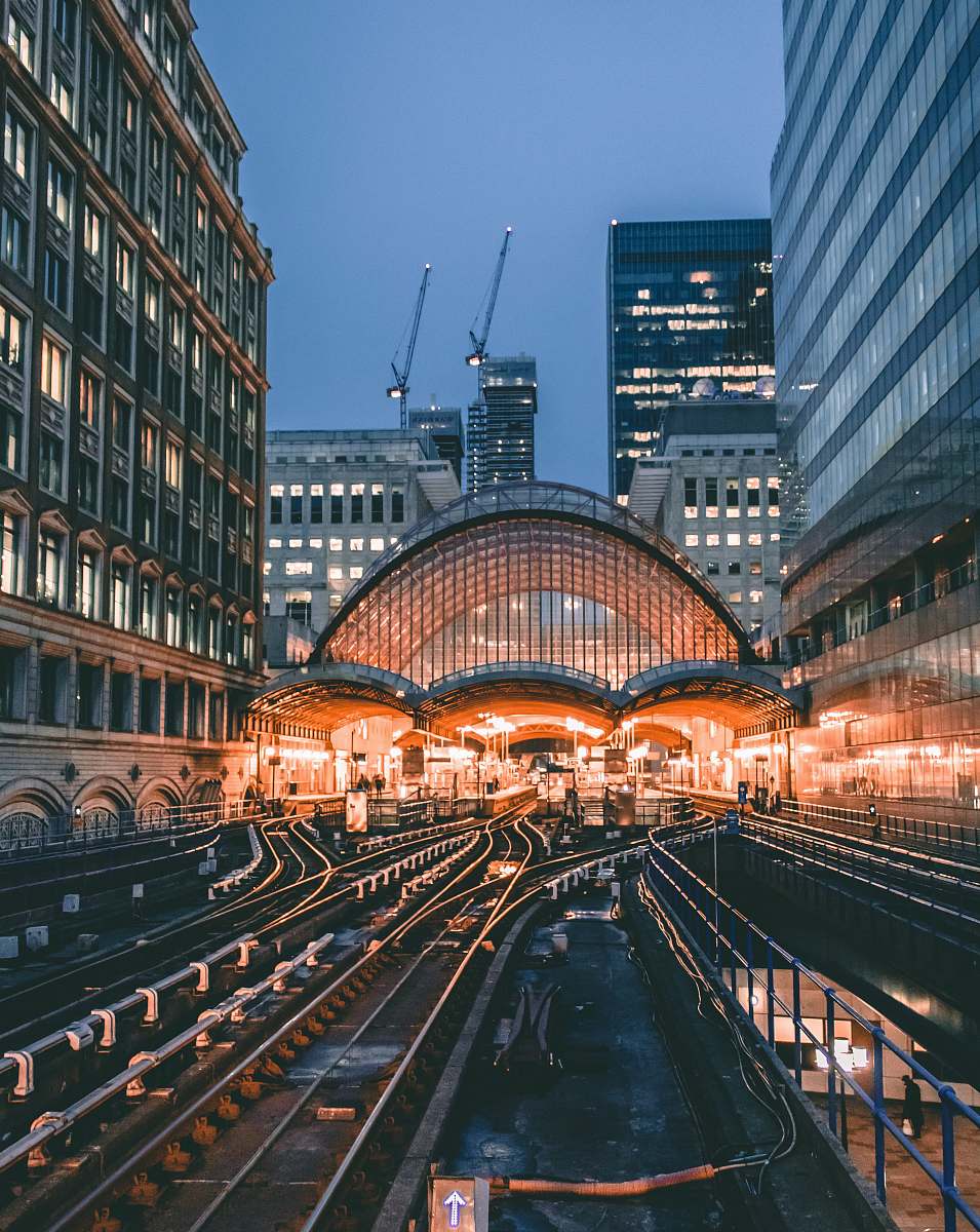 building aerial photo of train railway surrounded by buildings metropolis