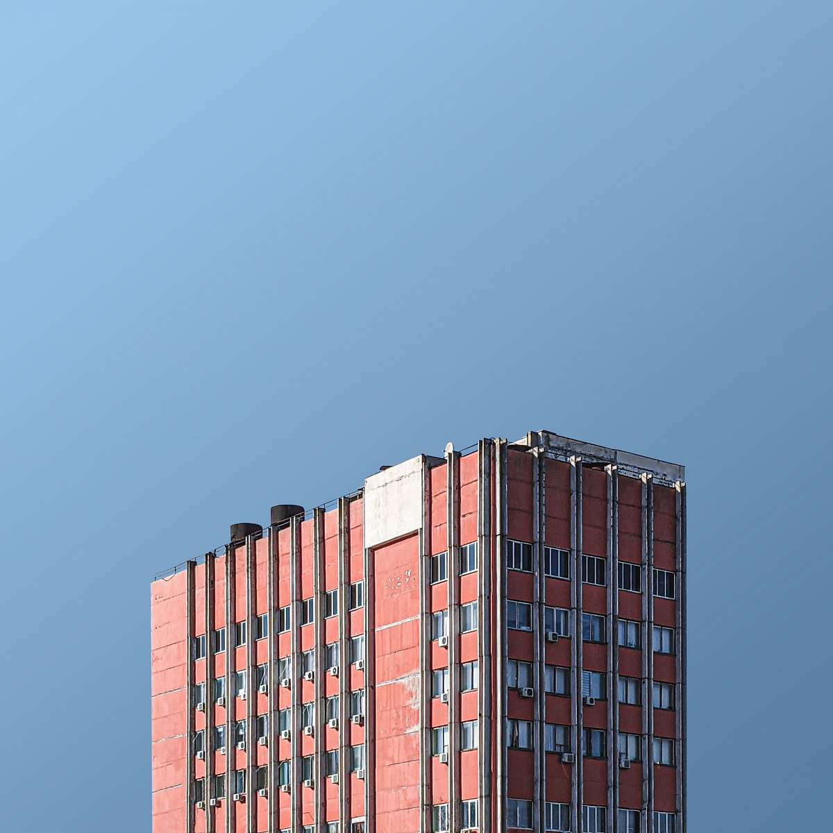 building aerial photography of brown concrete building high rise