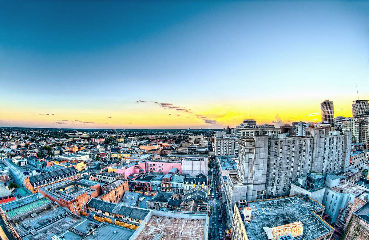 building aerial photography of city buildings during yellow sunset urban