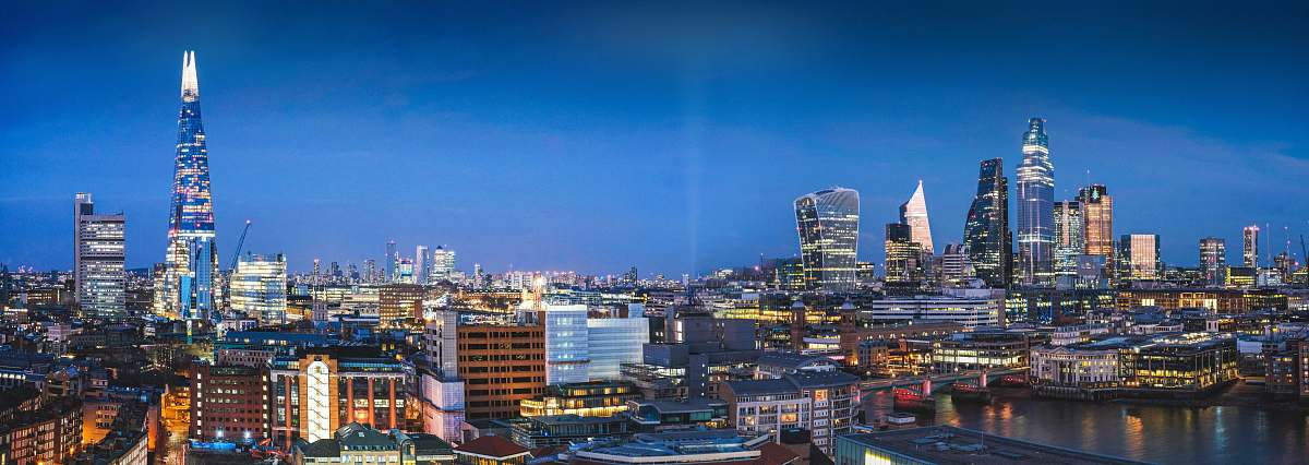 urban aerial photography of city with high-rise buildings during night time town