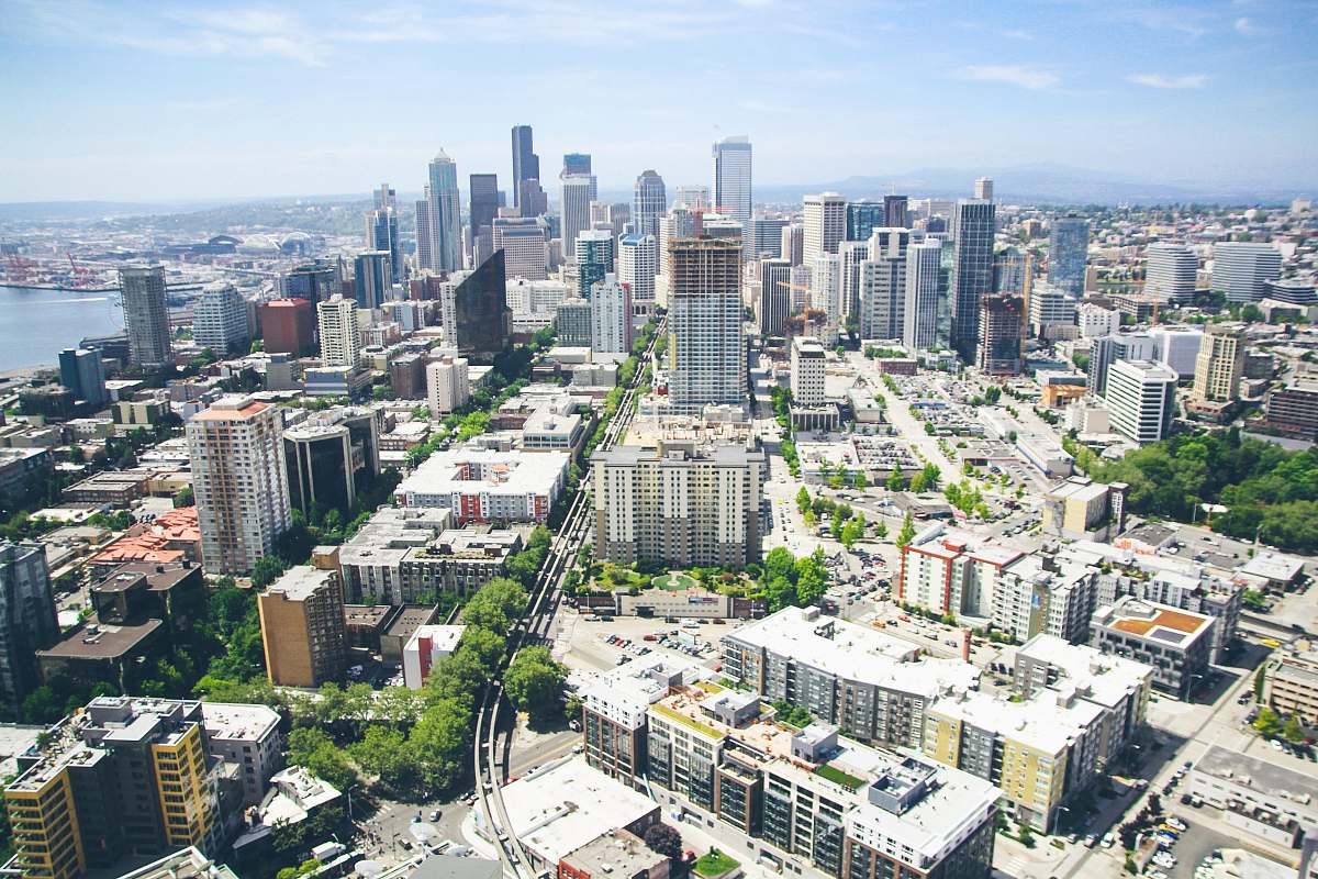 building aerial photography of high-rise building under white and blue sky town