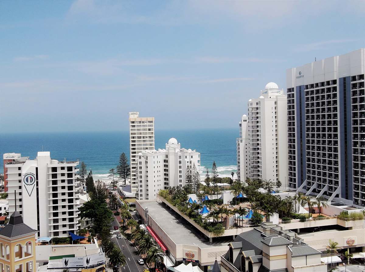 building aerial view of city buildings across body of water high rise