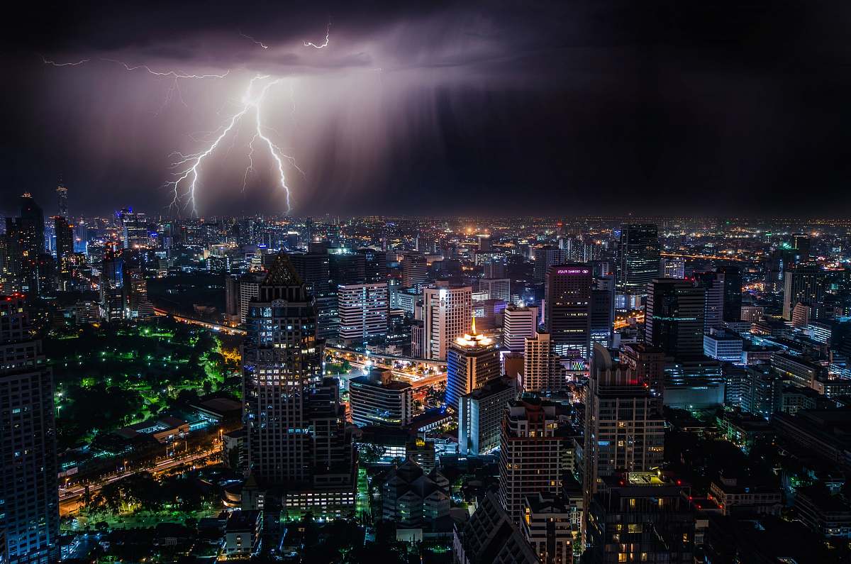building aerial view of city buildings with lightning strike bangkok