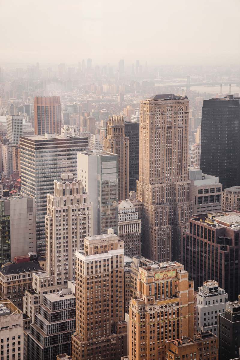 building aerial view of city under cloudy sky during day time architecture