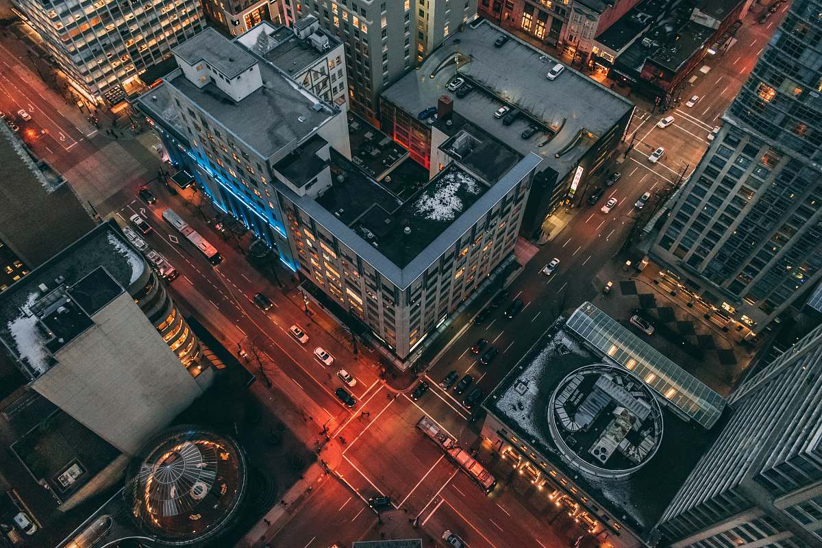 road aerial view photography of highrise building intersection