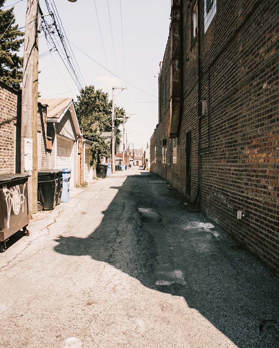 building alley during daytime road