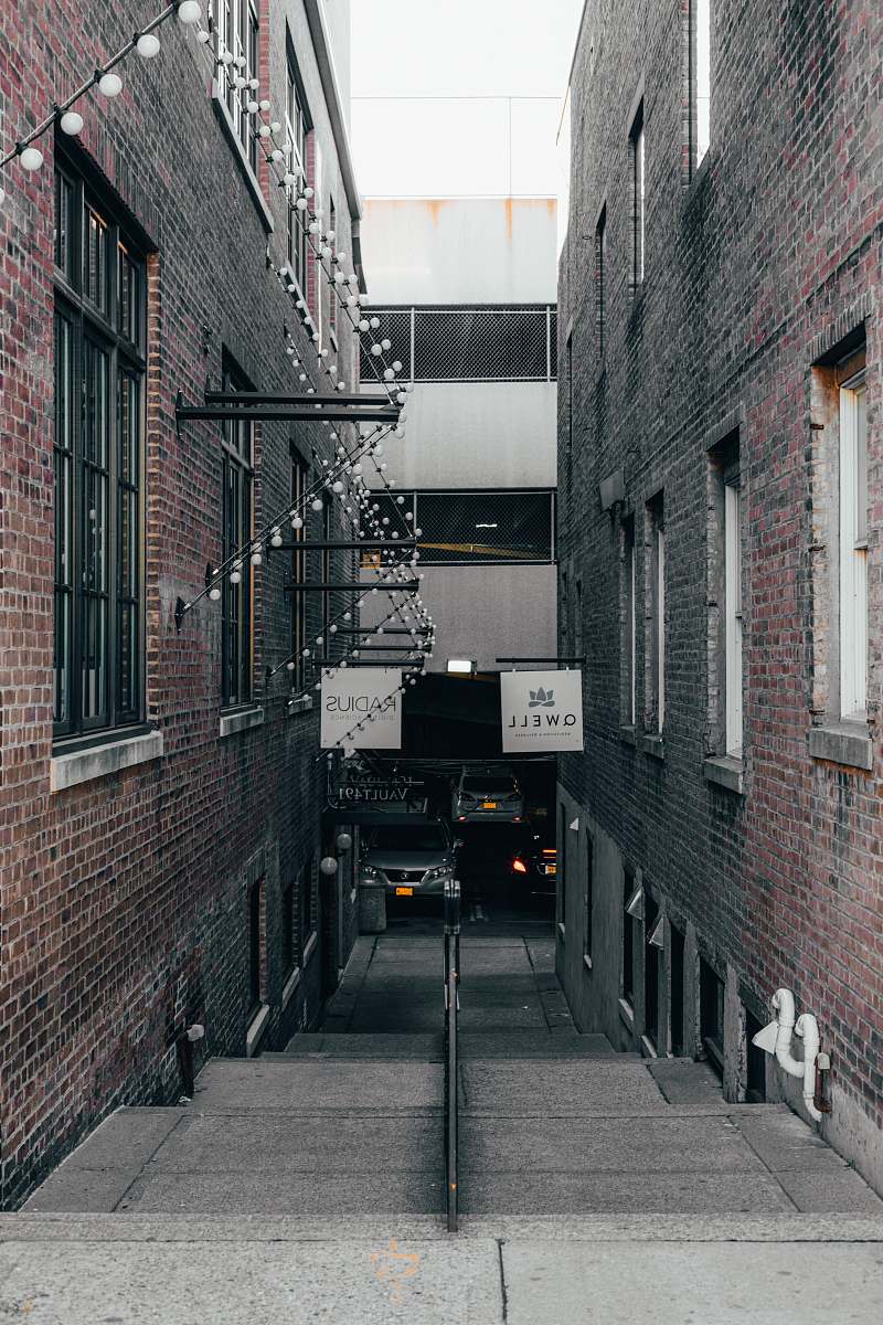 building alley road between buildings road