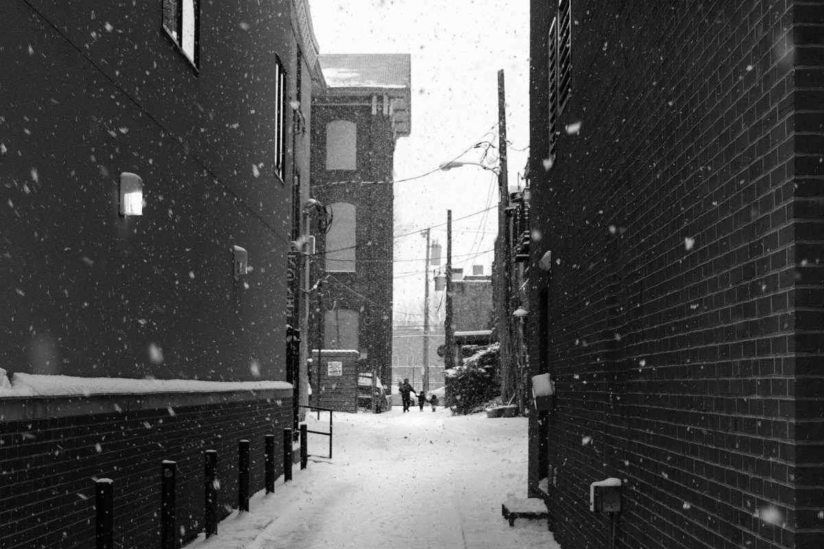 black-and-white alley surrounded by snow alley